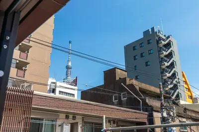 a view of the eiffel tower in the city at YADOYA Sennokaze in Tokyo