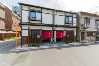 a building on the side of a street at YADOYA Sennokaze in Tokyo