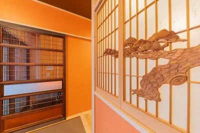 a room with a door with a dragon on the wall at YADOYA Sennosato in Tokyo