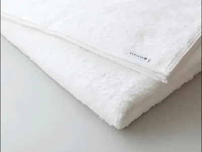 a white bedsheet with the word mattress on it at 9h nine hours Suidobashi in Tokyo
