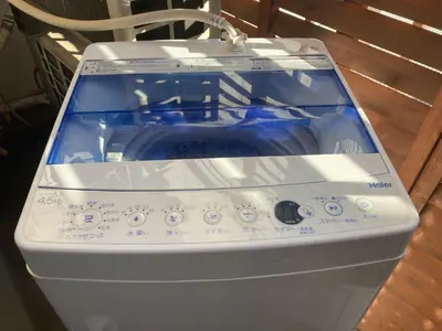 a close up of a washing machine sitting on a table at 2BR 4beds Shibuya Shinjuku Harajuku 10min wifi in Tokyo