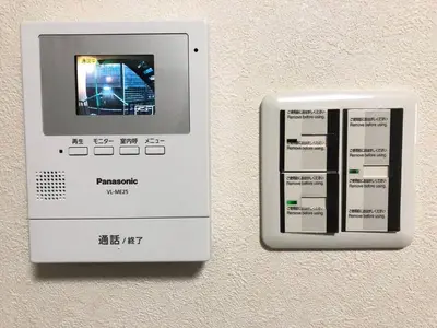 a machine with a picture on the side of a wall at Julian home Shinagawa 5 mins Shibuya 7 mins in Tokyo