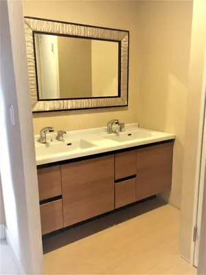 a bathroom with a sink and a mirror at Himalaya Cloud Hotel in Tokyo