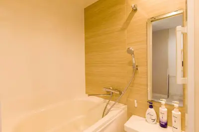 a bathroom with a white tub and a shower at Himalaya Cloud Hotel in Tokyo