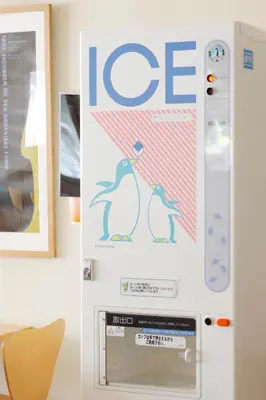 a refrigerator with the word ice and two penguins on it at Hotel Lumiere Nishikasai in Tokyo
