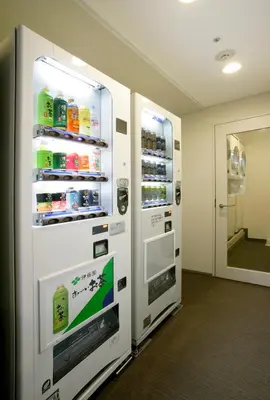 a large white refrigerator in a room at Hotel Lumiere Nishikasai in Tokyo