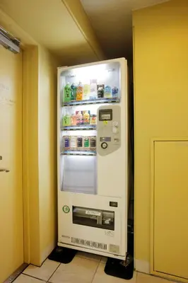 a refrigerator with its door open in a room at Hotel Lumiere Kasai in Tokyo