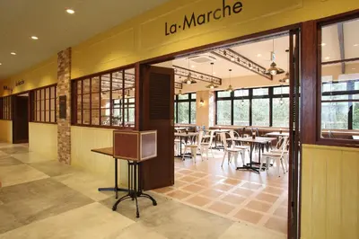 a dining area with tables and chairs in a restaurant at HOTEL EURASIA MAIHAMA ANNEX in Urayasu