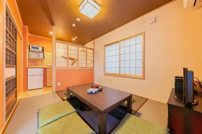 a living room with a table and a tv at Yadoya Asakusa Sennosato / Vacation STAY 46671 in Tokyo