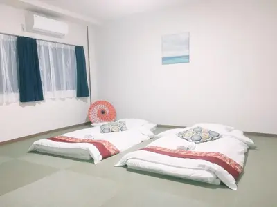 two beds sitting next to each other in a room at ohayo\u672c\u6240 in Tokyo