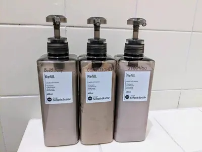 three bottles of soap sitting on top of a counter at SquareHouse Nishiarai in Tokyo