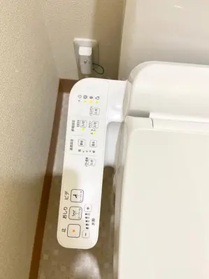 a remote control for a toilet in a bathroom at Upper Hotel Ryogoku in Tokyo