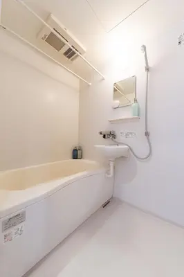 a bathroom with a bath tub and a sink at Ueno Garden House - 2 mins walk to subway, 2 mins train to Akihabara, 2 mins train to Asakusa in Tokyo
