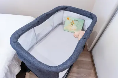 a bed frame with a book on top of it at Ueno Garden House - 2 mins walk to subway, 2 mins train to Akihabara, 2 mins train to Asakusa in Tokyo