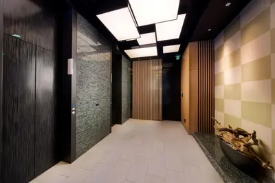 a hallway of a building with wooden walls and a ceiling with lights at Best Western Hotel Fino Tokyo Akasaka in Tokyo