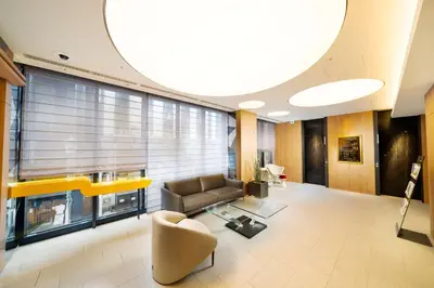 a living room with a couch and a large window at Best Western Hotel Fino Tokyo Akasaka in Tokyo