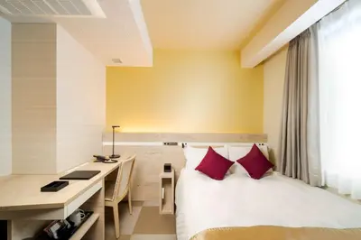 a hotel room with a bed and a desk at Best Western Hotel Fino Tokyo Akasaka in Tokyo
