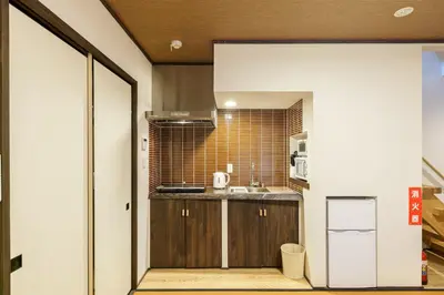 a small kitchen with a sink and a counter at YADOYA Sennokawa in Tokyo