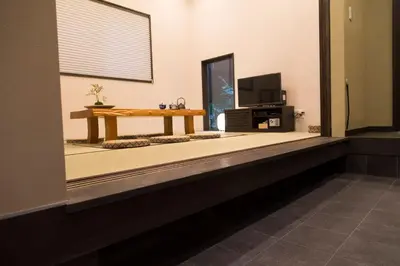 a living room with a table and a tv at YADOYA Asakusa-Honkan in Tokyo