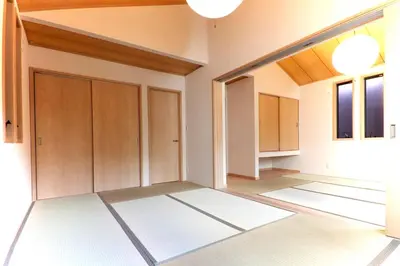 an empty room with a door and some windows at YADOYA Asakusa-Honkan in Tokyo