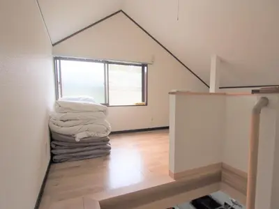 a room with a pile of towels on the floor at House Kadoi201 in Tokyo