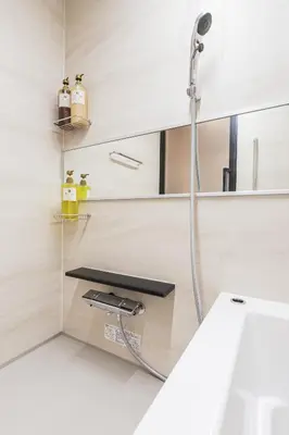 a shower in a bathroom with a sink at Ostay Nippori Hotel Apartment (Nishi-Nippori Sta.) in Tokyo