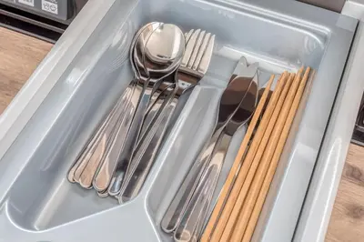 a drawer filled with utensils in a refrigerator at Ostay Nippori Hotel Apartment (Nishi-Nippori Sta.) in Tokyo