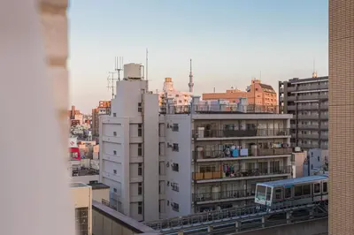a view of a city with a bus on a building at Ostay Nippori Hotel Apartment (Nishi-Nippori Sta.) in Tokyo