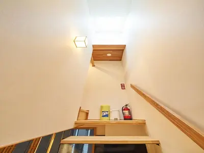 a staircase in a house with a light on it at YADOYA Kisakata in Tokyo