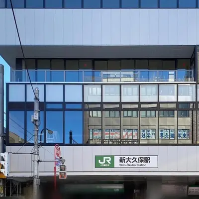 a building with a sign on the side of it at Hotel Koryukaku in Tokyo