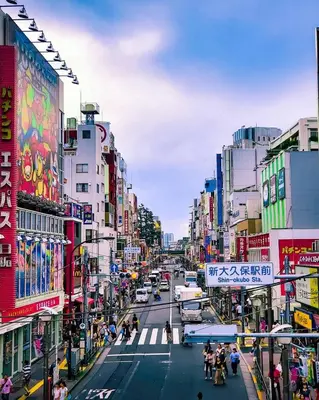 a busy street in an asian city with buildings at Hotel Koryukaku in Tokyo