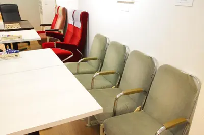 a row of chairs in a waiting room at \u90fd\u96fb\u5c4b TodenHotel in Tokyo