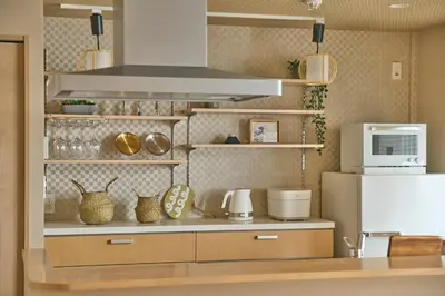 a kitchen with a counter top with a microwave at \u30b3\u30f3\u30c9\u30df\u30cb\u30a2\u30e0\u30db\u30c6\u30eb \u6e0b\u8c37GOTEN Condominium Hotel Shibuya GOTEN in Tokyo