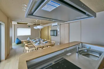 a kitchen and dining room with a table and chairs at \u30b3\u30f3\u30c9\u30df\u30cb\u30a2\u30e0\u30db\u30c6\u30eb \u6e0b\u8c37GOTEN Condominium Hotel Shibuya GOTEN in Tokyo