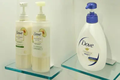 two bottles of dole laundry detergent on two glass shelves at \u30b3\u30f3\u30c9\u30df\u30cb\u30a2\u30e0\u30db\u30c6\u30eb \u6e0b\u8c37GOTEN Condominium Hotel Shibuya GOTEN in Tokyo