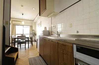a kitchen with a counter and a dining room at 2-9-13 / Vacation STAY 4897 in Tokyo