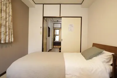 a bedroom with a white bed and a window at 2-9-13 / Vacation STAY 4897 in Tokyo
