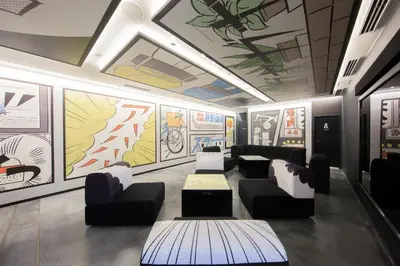 a waiting room with couches and paintings on the walls at HOTEL TAVINOS Hamamatsucho - Vacation STAY 51015 in Tokyo