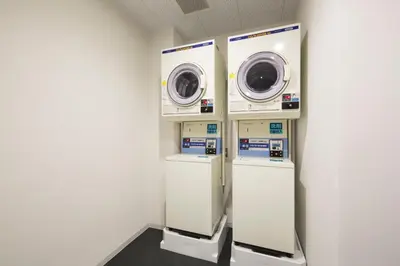 a laundry room with two washer and dryer at HOTEL TAVINOS Hamamatsucho - Vacation STAY 51015 in Tokyo