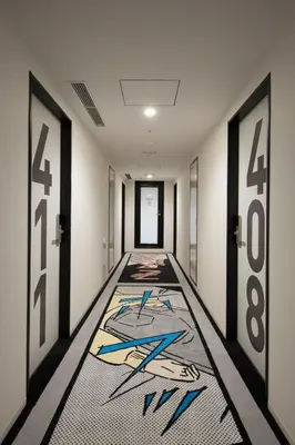 a hallway with a carpet with a painting on it at HOTEL TAVINOS Hamamatsucho - Vacation STAY 51015 in Tokyo