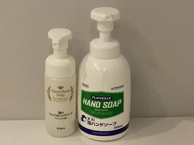 two bottles of hand sanitizer sitting next to each other at Roppongi Plaza Hotel in Tokyo