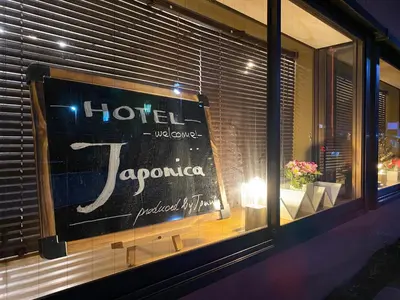 a sign in a window of a hotel at HOTEL Japonica in Tokyo