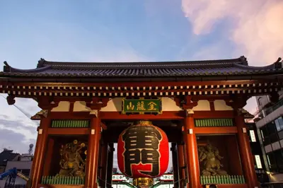 a building with a sign with a face on it at Private Hotel Oshiage in Tokyo