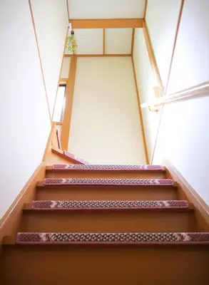 a set of stairs in a building at \u9326\u306e\u9928 Nishiki\u306eYakata in Tokyo
