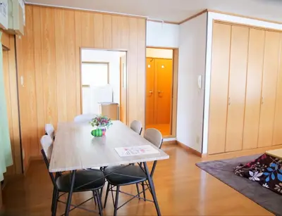 a dining room with a table and chairs at \u9326\u306e\u9928 Nishiki\u306eYakata in Tokyo