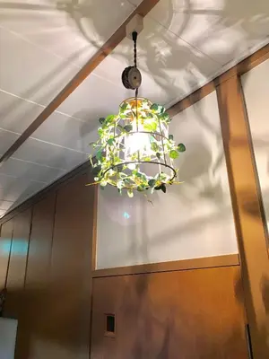 a chandelier hanging from a ceiling in a room at \u9326\u306e\u9928 Nishiki\u306eYakata in Tokyo