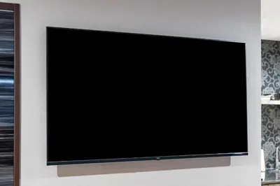 a flat screen tv hanging on a wall at ESTABLISHMENT Asakusa in Tokyo