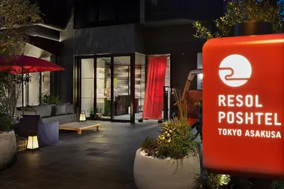 a sign for a restaurant in front of a building at Resol Poshtel Tokyo Asakusa in Tokyo