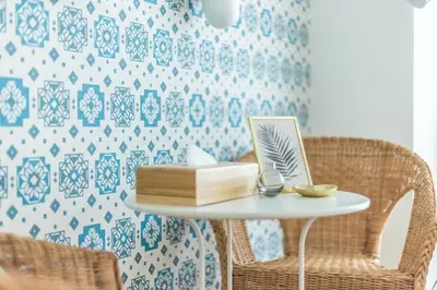 a table with a book and two chairs at SHINJUKU Residence BLDG in Tokyo