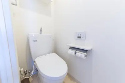 a bathroom with a white toilet in a room at SHINJUKU Residence BLDG in Tokyo
